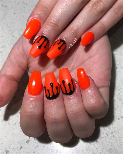 orange and black acrylic nails